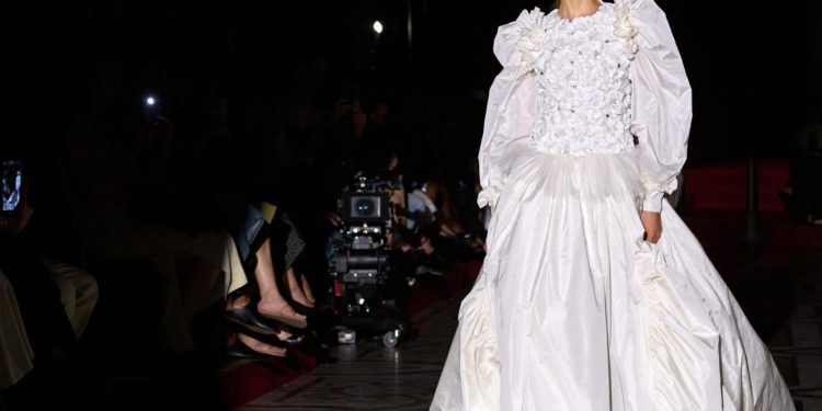 Chanel presents haute couture apparel at the Opera theater in Paris.