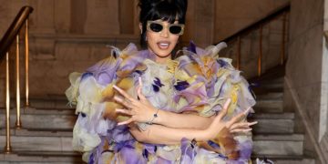 Cardi B sparks pregnancy rumors by wearing an enormous dress and arriving to the Marc Jacobs fashion presentation in sty